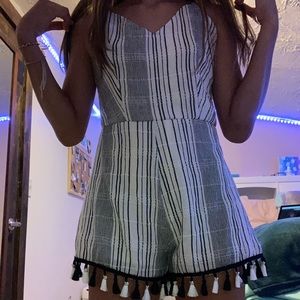 Womens black and white striped romper with tassels